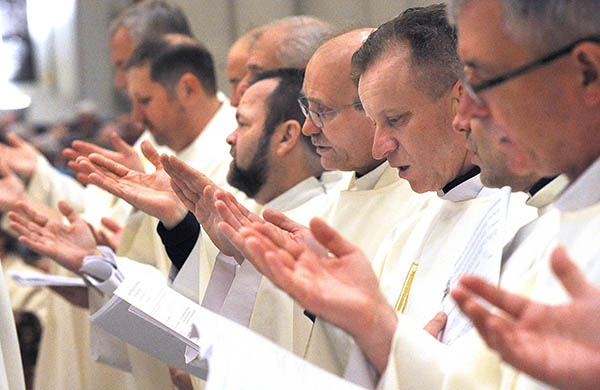 Area priests pray at St. Joseph Cathedral during the annual Chrism Mass. (Dan Cappellazzo/Staff Photographer)
